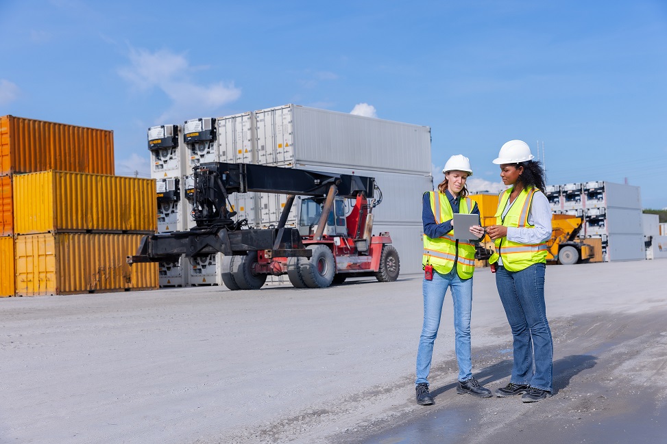 female-workers-discussing-logistics